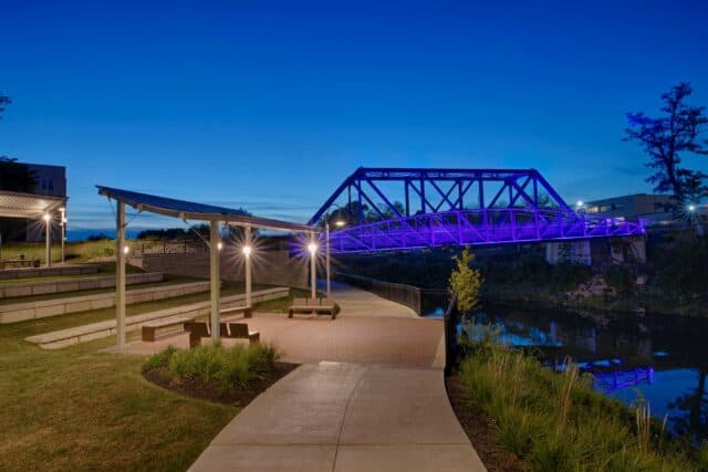 The lit up bridge over Wildcat Creek near the Walk of Excellence in Kokomo, Indiana